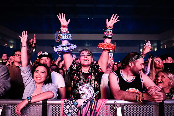 Three Fans cheer as Seven Lions performs at Hard Rock Live Sacramento in Wheatland, California on April 6, 2023. (Photo by Chris Tuite)